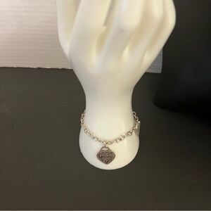 Good pre owned vintage condition  one charm bracelet